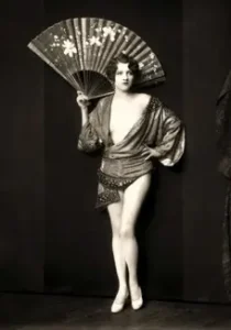 Portrait of Ziegfeld girl Jean Ackerman with a fan by Alfred Cheney Johnston, circa 1927