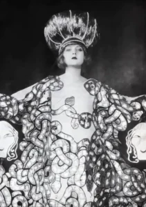 Imogene 'Bubbles' Wilson (Mary Nolan) posed as a Ziegfeld Follies showgirl in an elaborate beaded gown and a tall headdress.