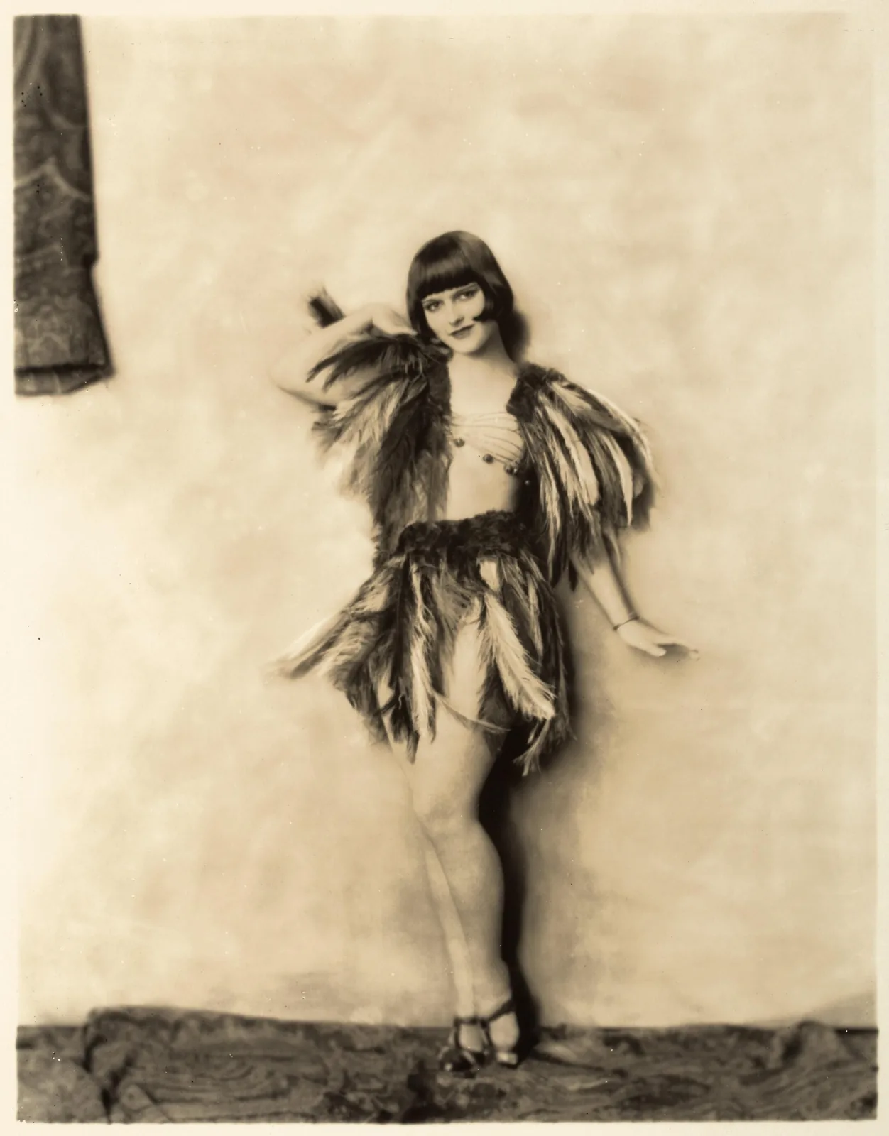 Louise Brooks in a feathered costume, photographed by Alfred Cheney Johnston in 1924