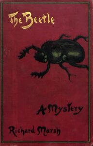 Red cloth binding of Richard Marsh's The Beetle: A Mystery, stamped with a large black beetle